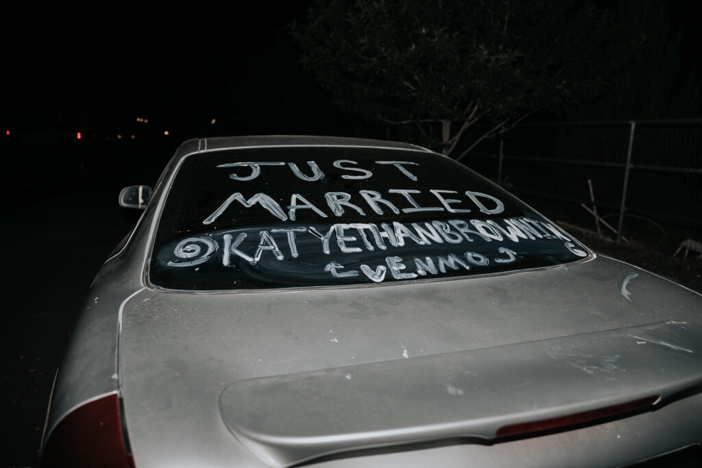 Just Married getaway car decorated for the couple’s wedding exit, showcasing fun and creative wedding send-off ideas for Phoenix weddings.